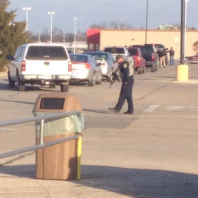 Law enforcement searching vehicles at the Walmart in Independence. (Photo by KOAM-Fox14 reporter Kelly Reid)